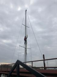 Critical Calculations!: We hired Ian Weedman, Rigger, to help guide us.  He is pictured up our Mast here meticulously placing strapes to accurately support our Mast once it
